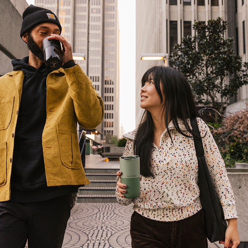 16oz-rise-tumbler-y7 16oz_rise_tumbler_black_iceberg_couple_drink_city_street_square.jpg