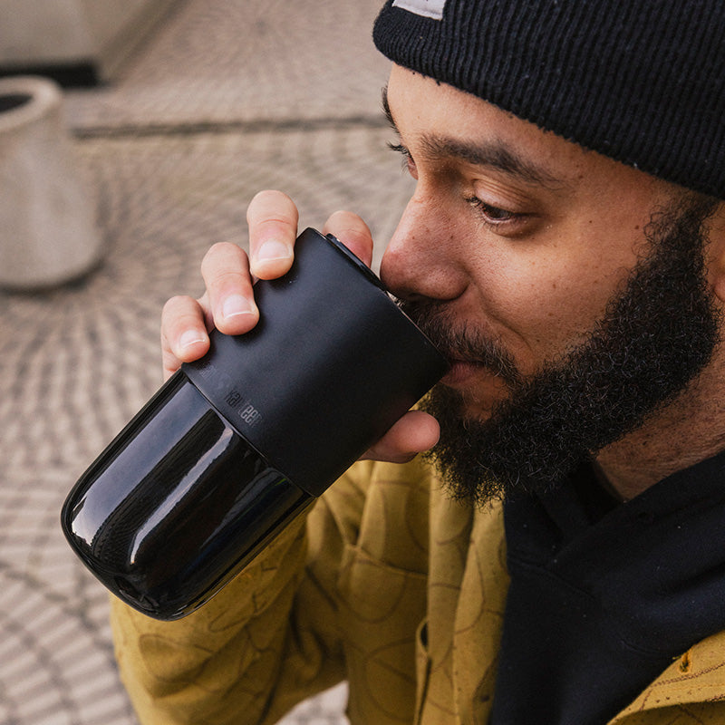 16oz-rise-tumbler-y7 16oz_rise_tumbler_black_man_drink_square.jpg