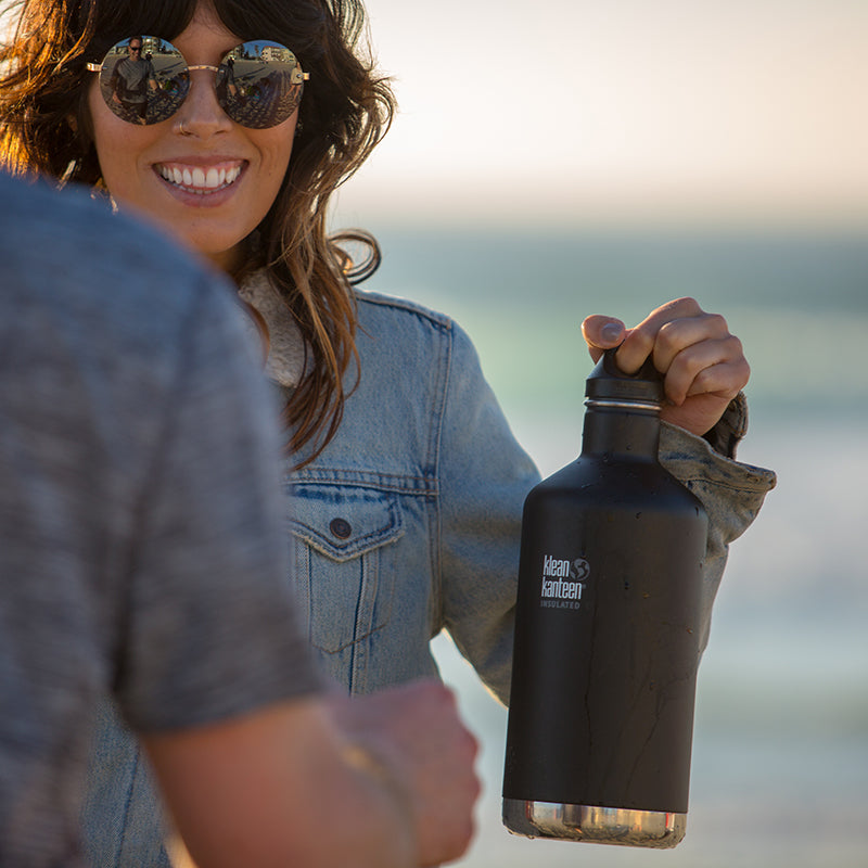 64oz-classic-with-loop-cap-w7 64oz_insulated_classic_black_beach_girl_hand_square.jpg